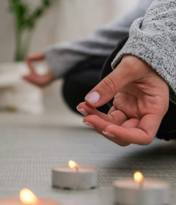 Close-up. Woman doing yoga exercise at home. Mindfulness meditation. Relax breathe easy pose gym hea